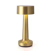 Aurora Gold table lamp on a white background