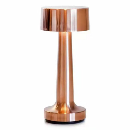 Front view of the Aurora bronze table lamp on a white background