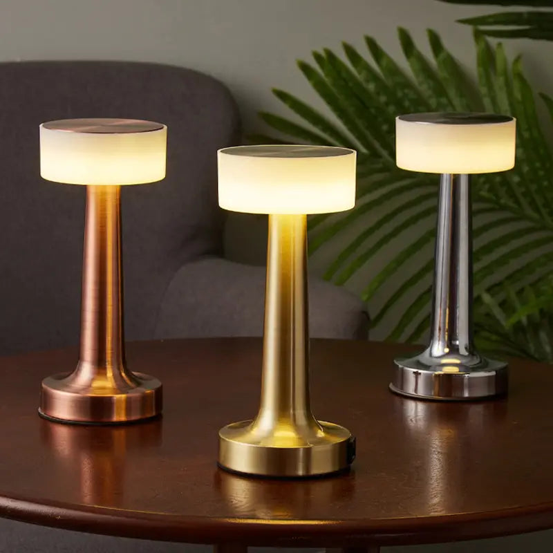 Aurora table lamp in Bronze, Gold, and Silver finishes