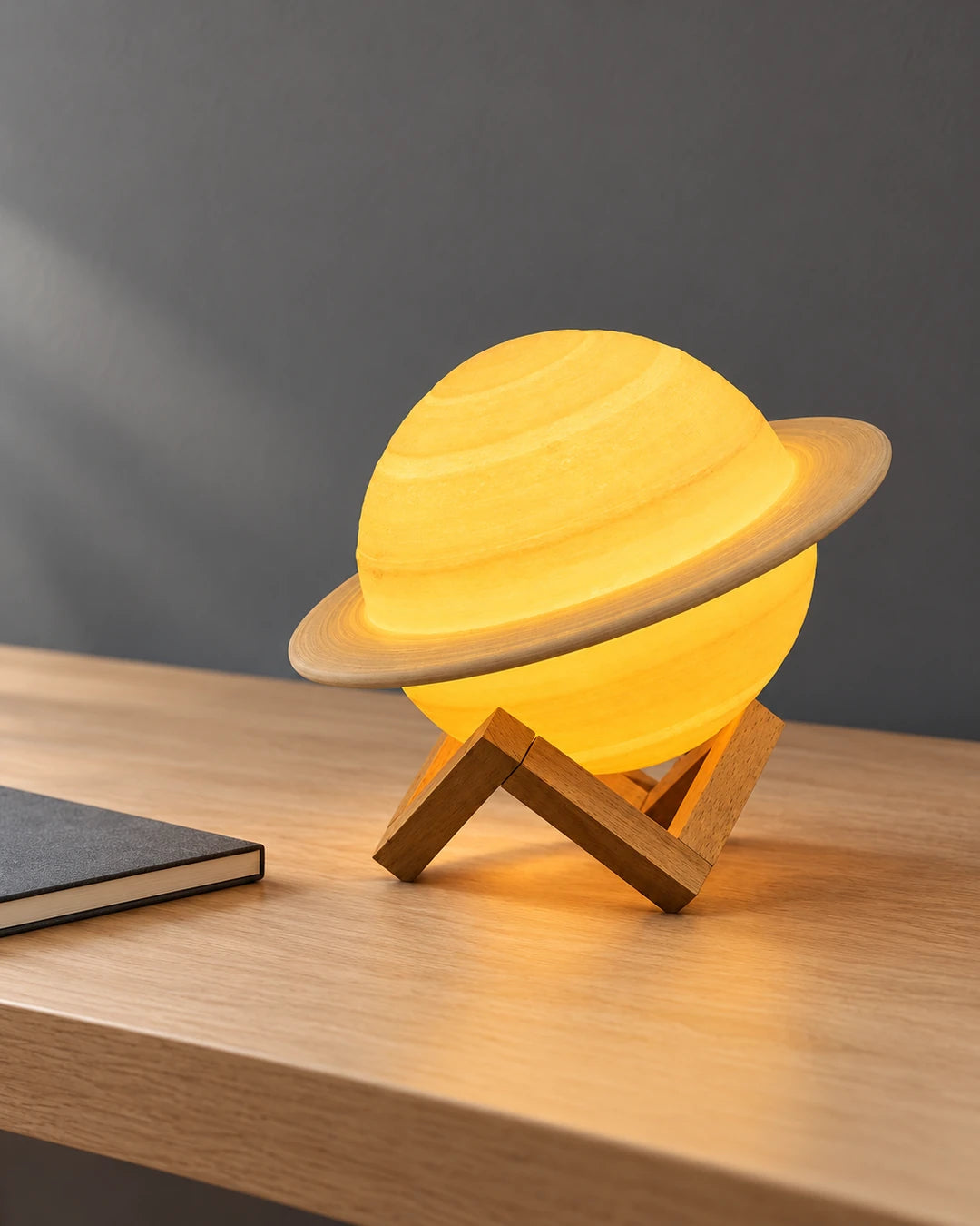 Tosena saturn lamp on a desk