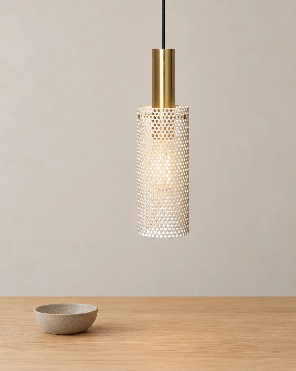 Zhulan white cylinder pendant above a wooden table